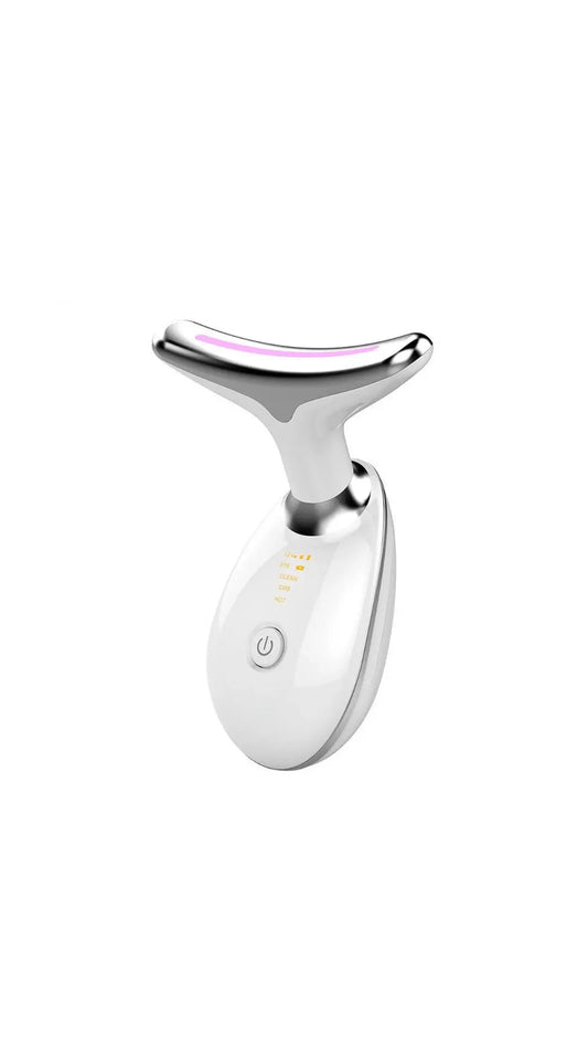 Silver facial roller with pink accents on a white background